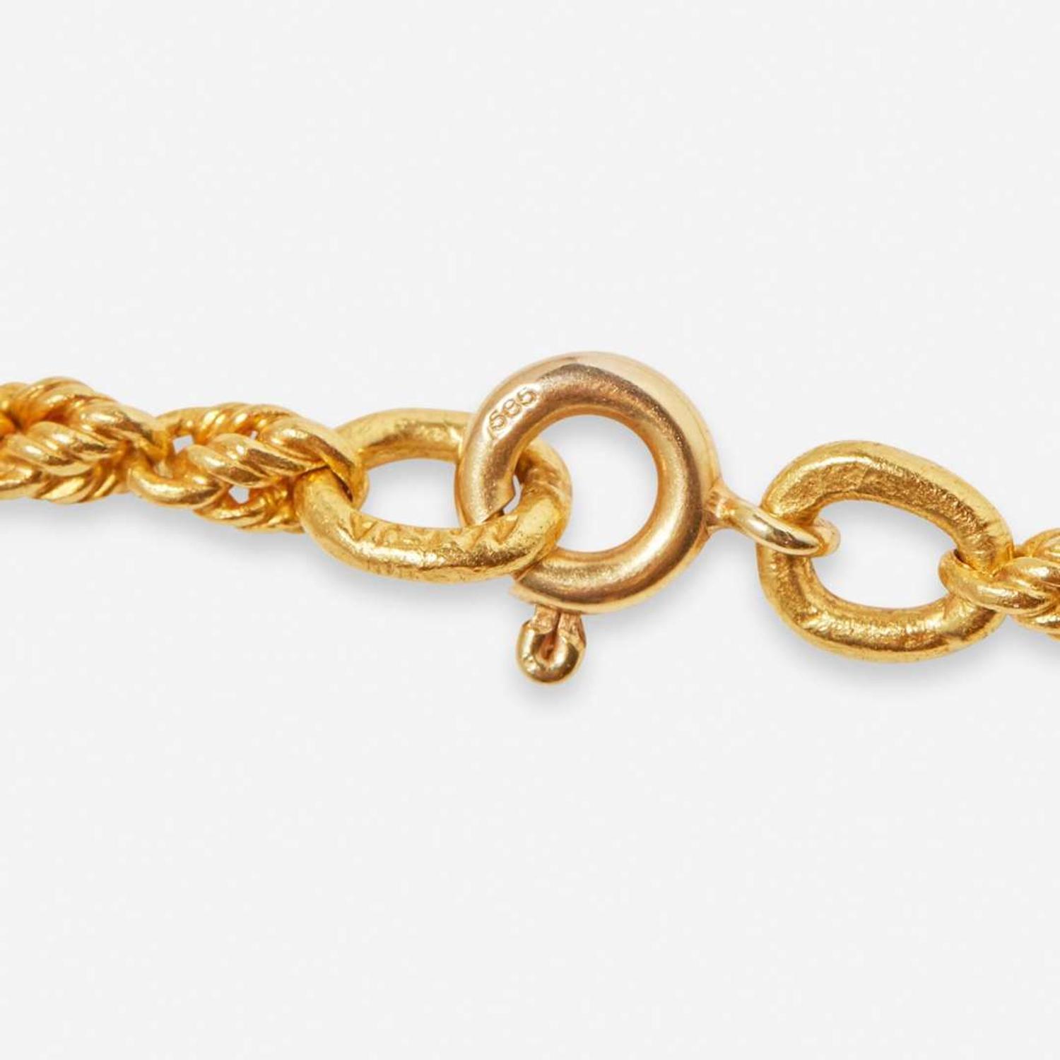 A Yellow Gold Peruvian Pendant and Chain
