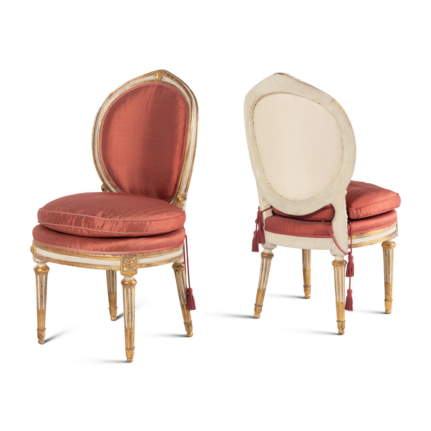 A Set of Four Italian Neoclassical Crème-Painted and Parcel Gilt Side Chairs