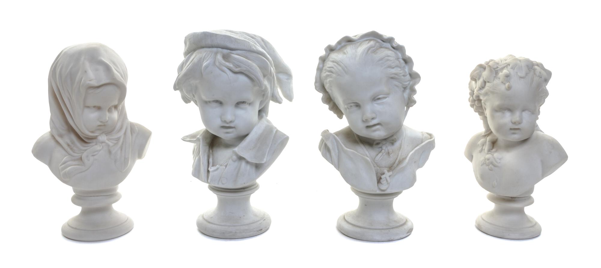 Four Parian Busts of Children Height of first 8 1/4 inches.