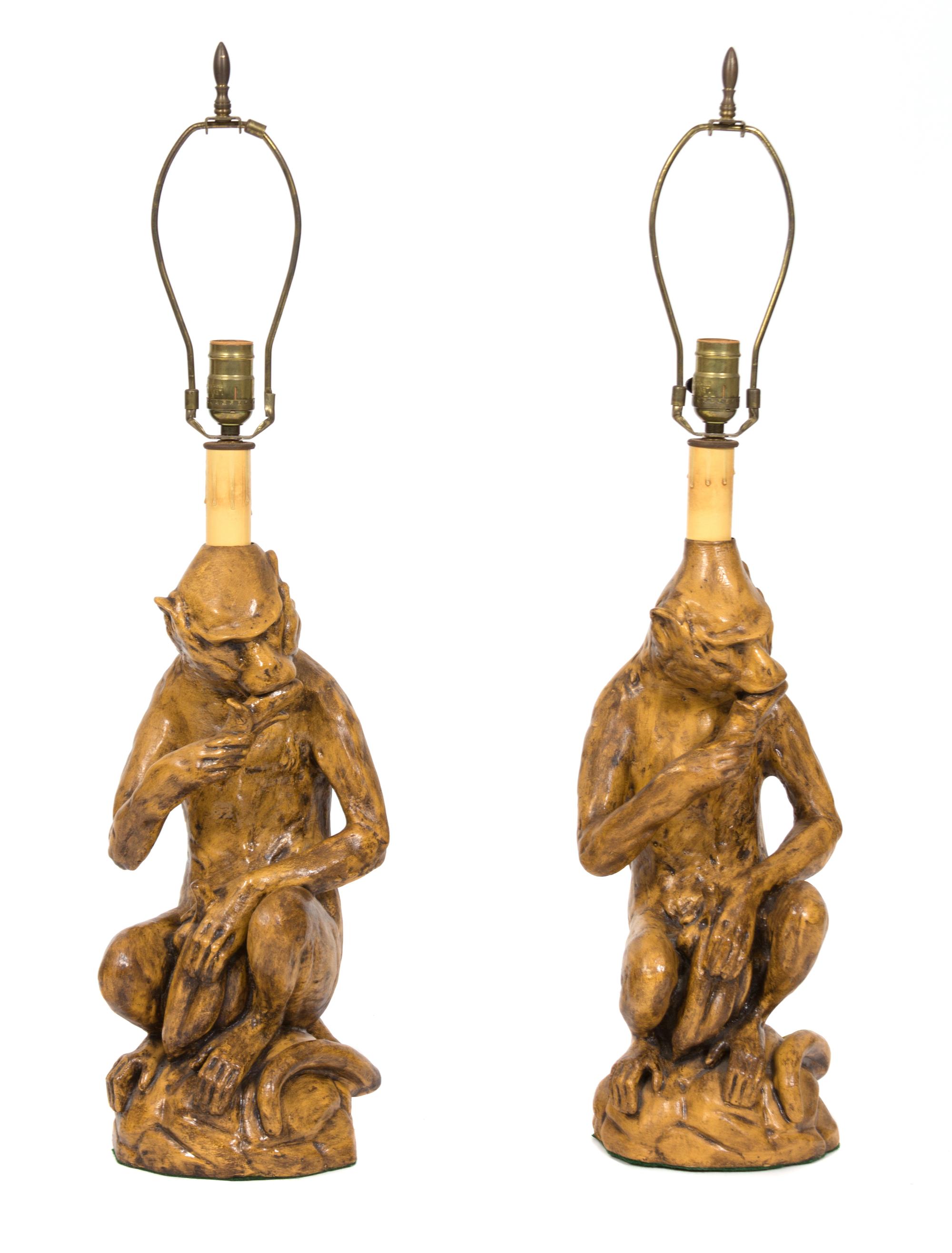 A Pair of Glazed Ceramic Monkey-Form Table Lamps Height overall 31 inches. — 20TH CENTURY