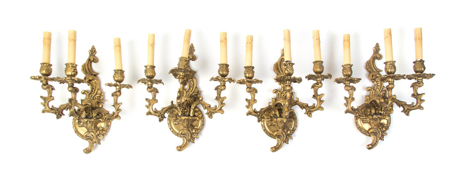 A Set of Four Louis XV Style Gilt Bronze Three-Light Sconces, Height 14 inches.
