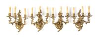 A Set of Four Louis XV Style Gilt Bronze Three-Light Sconces, Height 14 inches.
