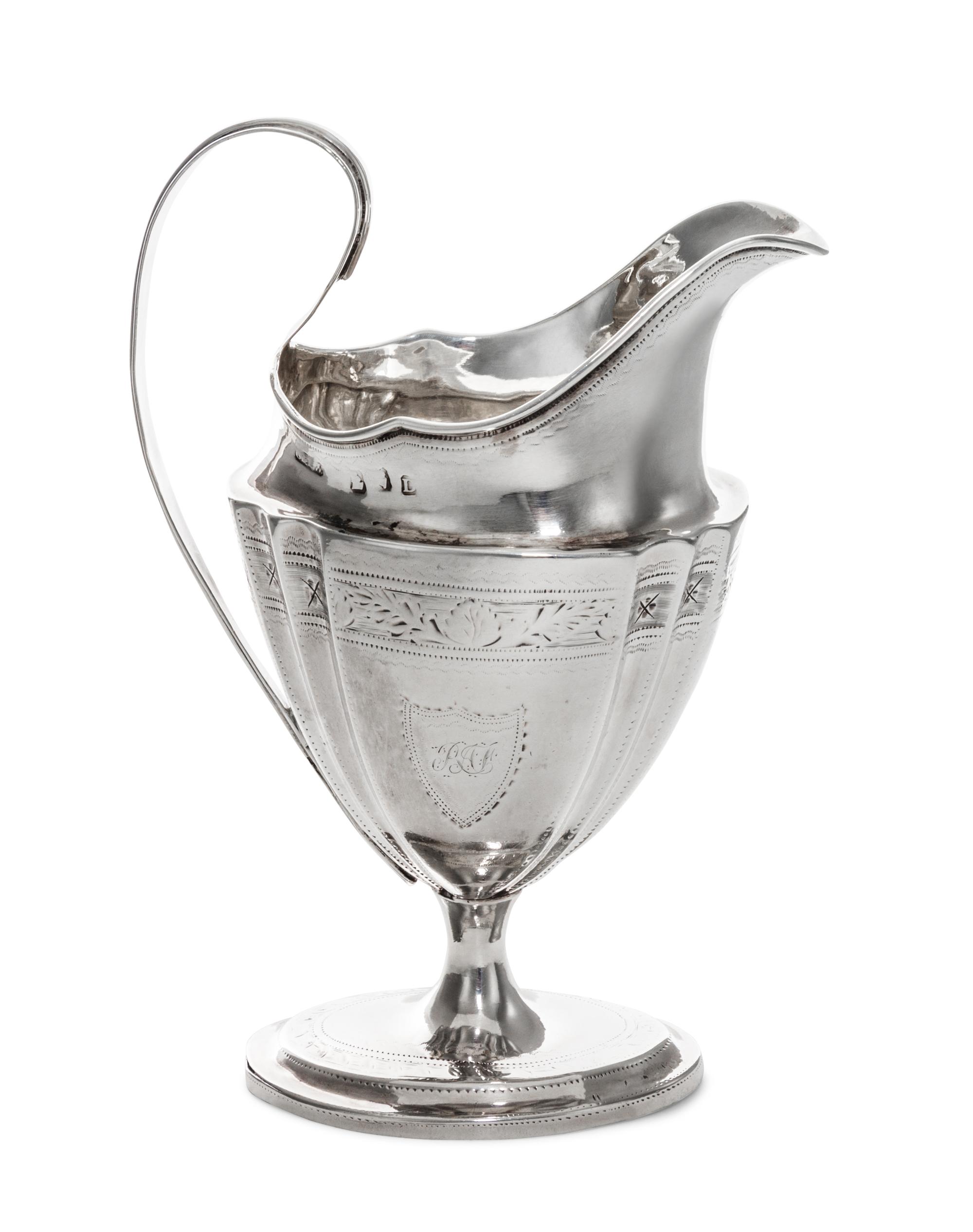 A George III Irish Silver Creamer, Dublin, Circa 1800, maker's mark rubbed, possibly G&PW, having incised floral decoration.