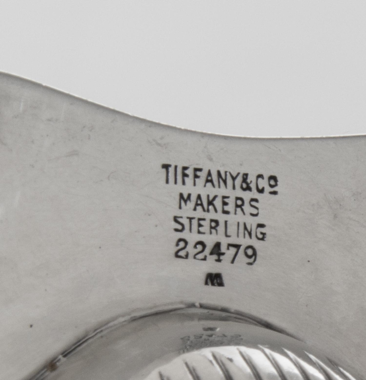 A Pair of American Silver Ash Receivers, Tiffany & Co., New York, NY, 1937, each of shell form with two feet.