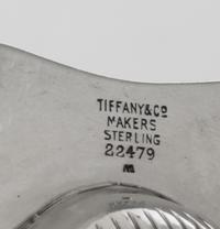 A Pair of American Silver Ash Receivers, Tiffany & Co., New York, NY, 1937, each of shell form with two feet.