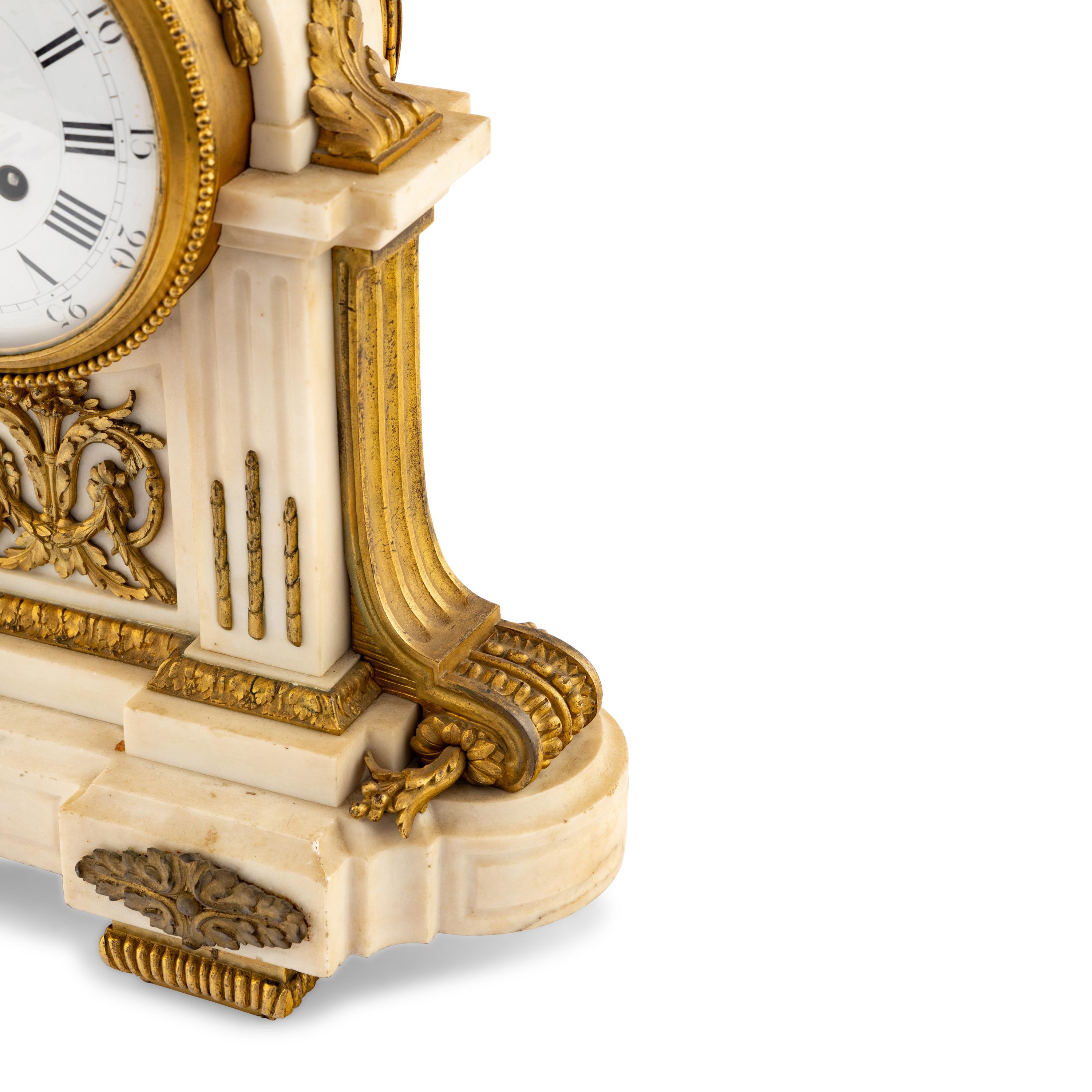 A Louis XVI Style Gilt Bronze Mounted Marble Mantel Clock