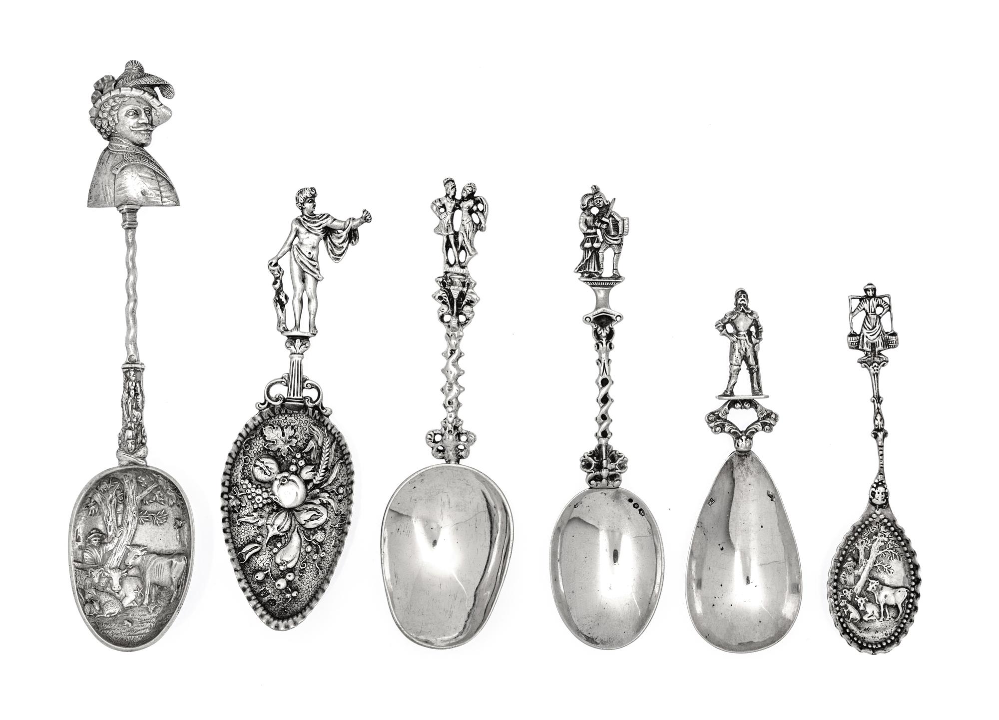 A Group of Six Continental Silver Serving Spoons, Various Makers, each having figural terminal.