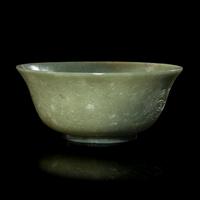 A Chinese Celadon Jade 'Dragon' Bowl, 20th Century 近代 青玉刻龍紋碗