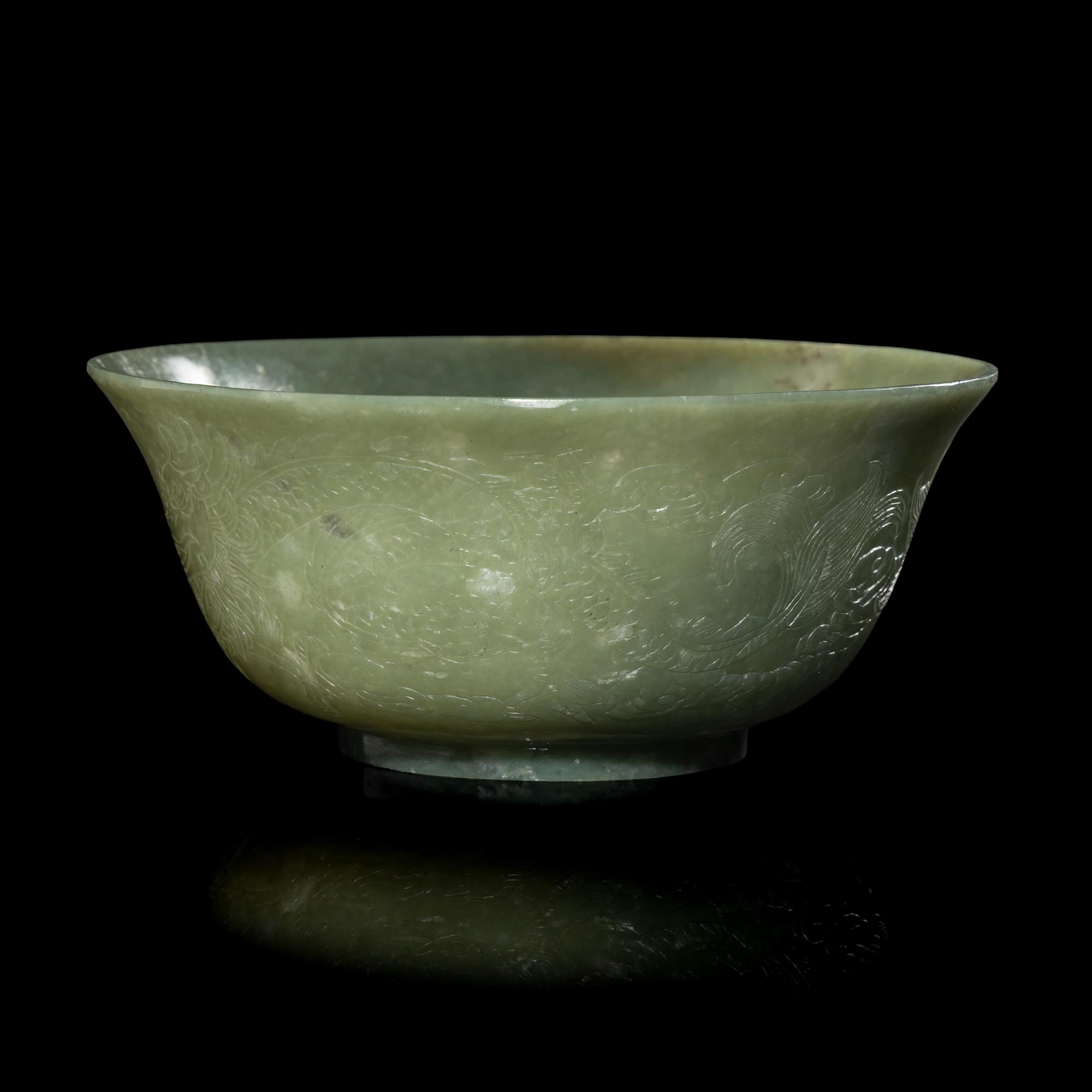 A Chinese Celadon Jade 'Dragon' Bowl, 20th Century 近代 青玉刻龍紋碗