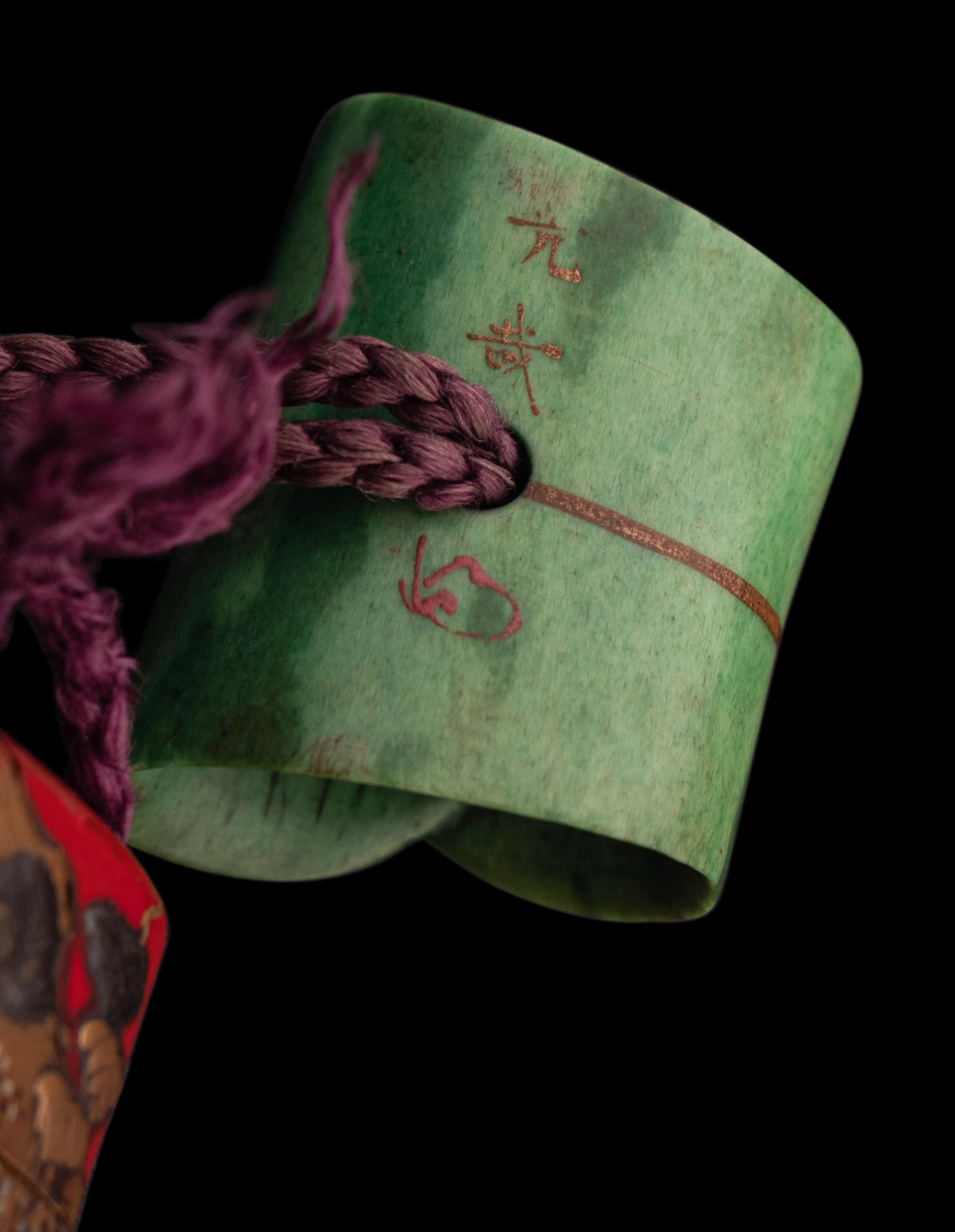 A Japanese Inlaid Gold and Red Lacquer Three-Case Inro