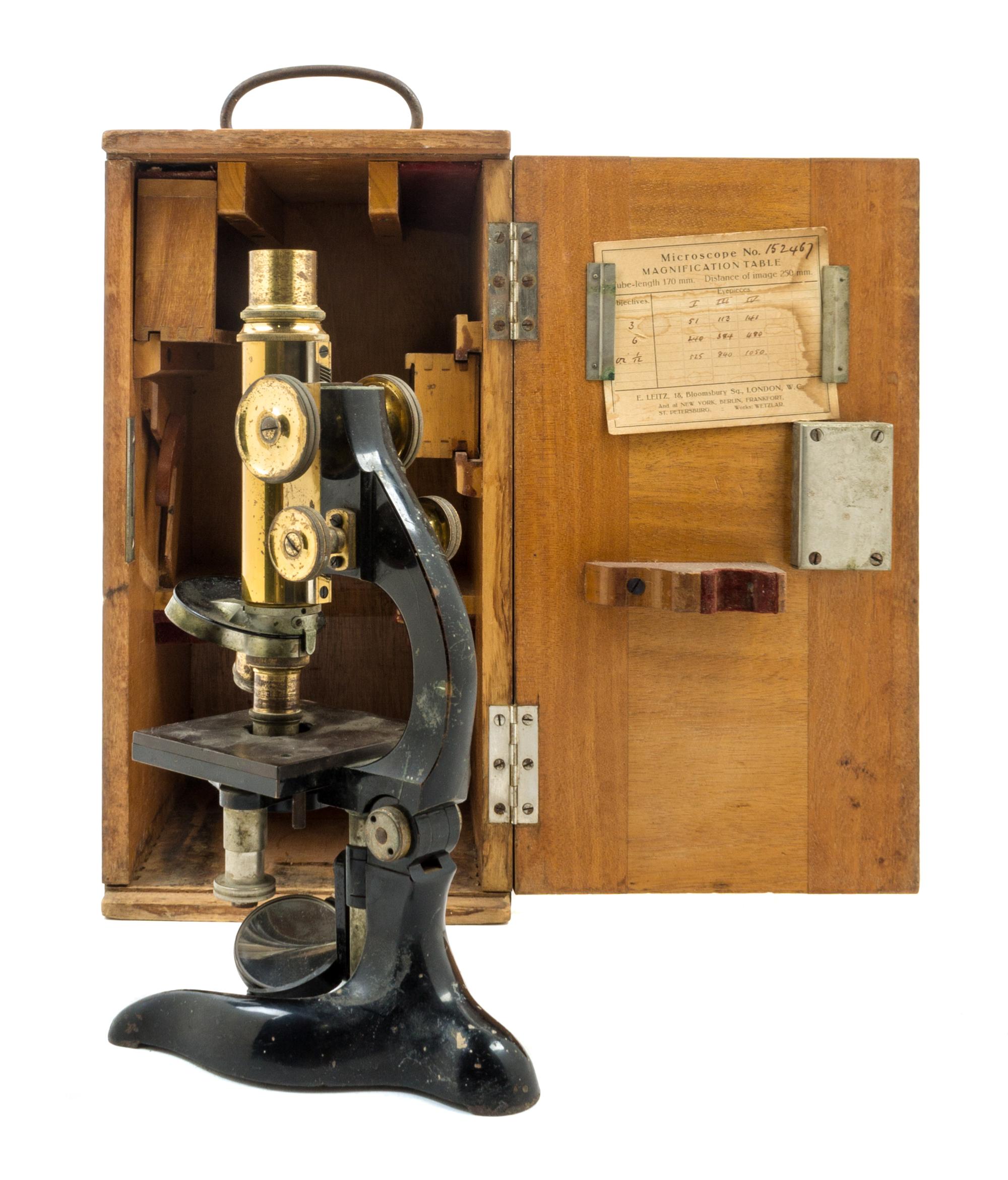 A German Brass and Black Lacquered Microscope Height 10 3/4 inches. — LEITZ, RETAILED BY LYNES MATHEWS, CAPETOWN, EARLY 20TH CENTURY