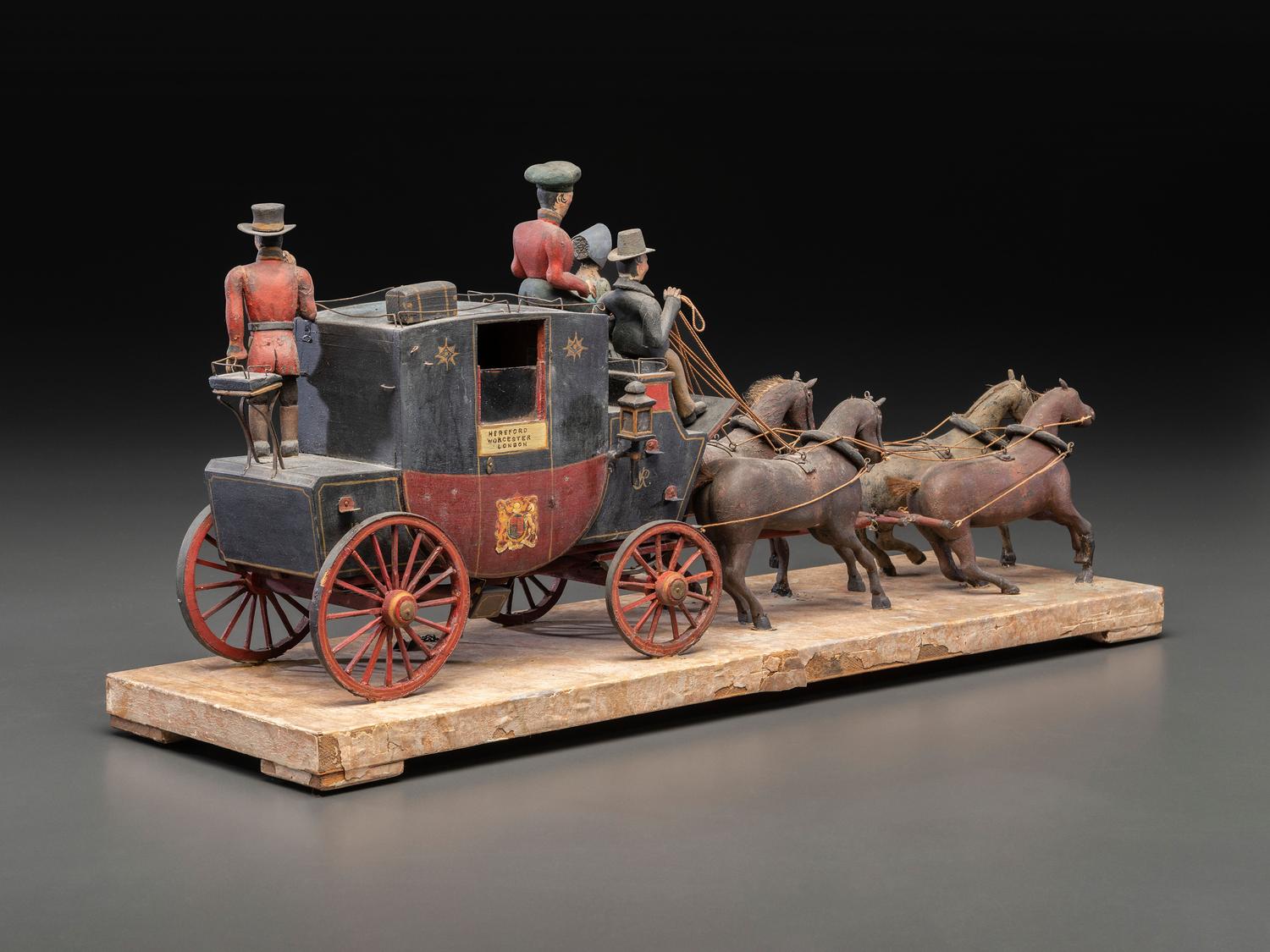 A Folk Art Carved and Painted Wood English Royal Stagecoach