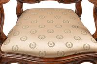 A Pair of Venetian Carved Walnut Armchairs