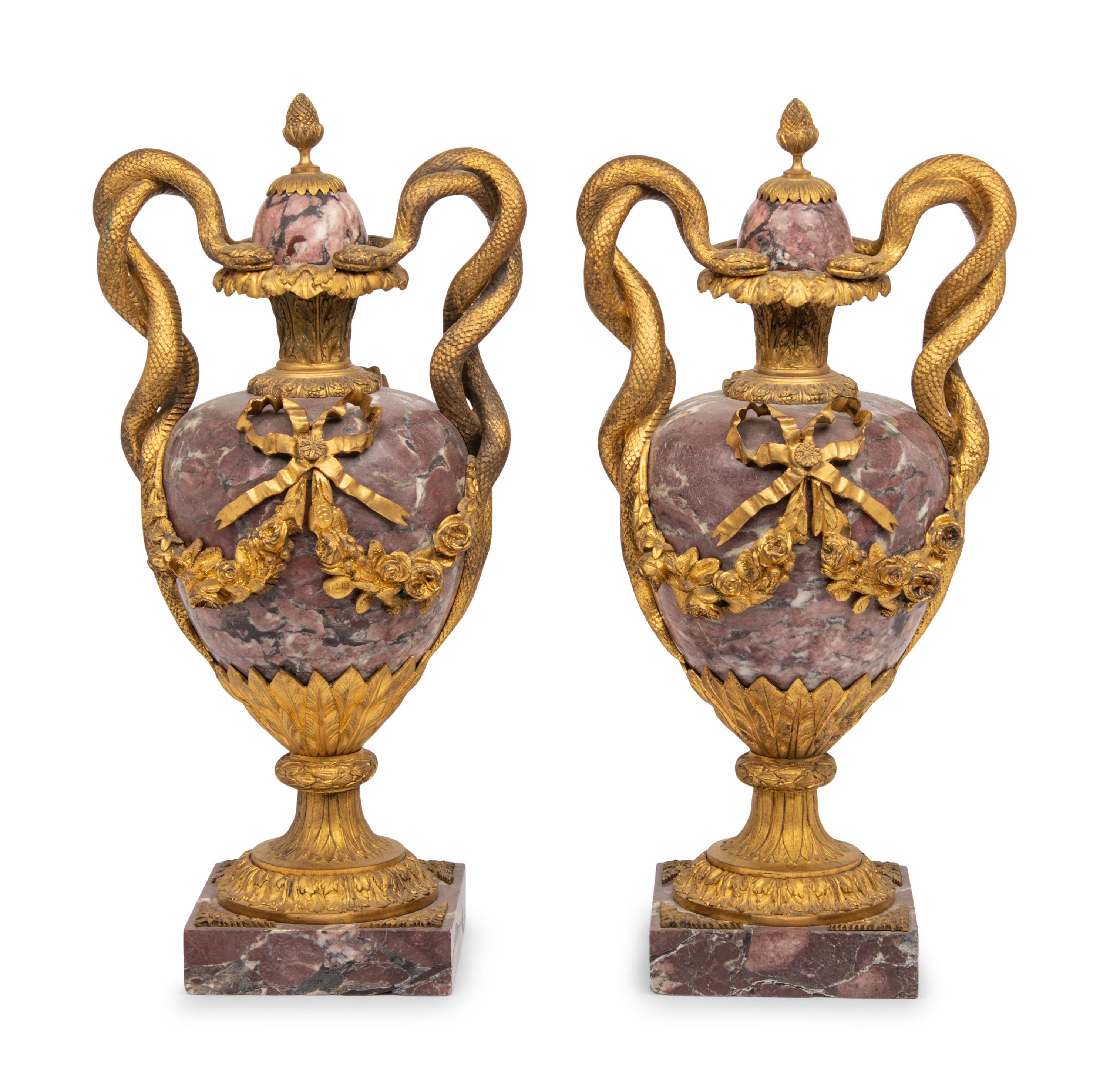 A Pair of French Gilt Bronze Mounted Breche Violette Urns