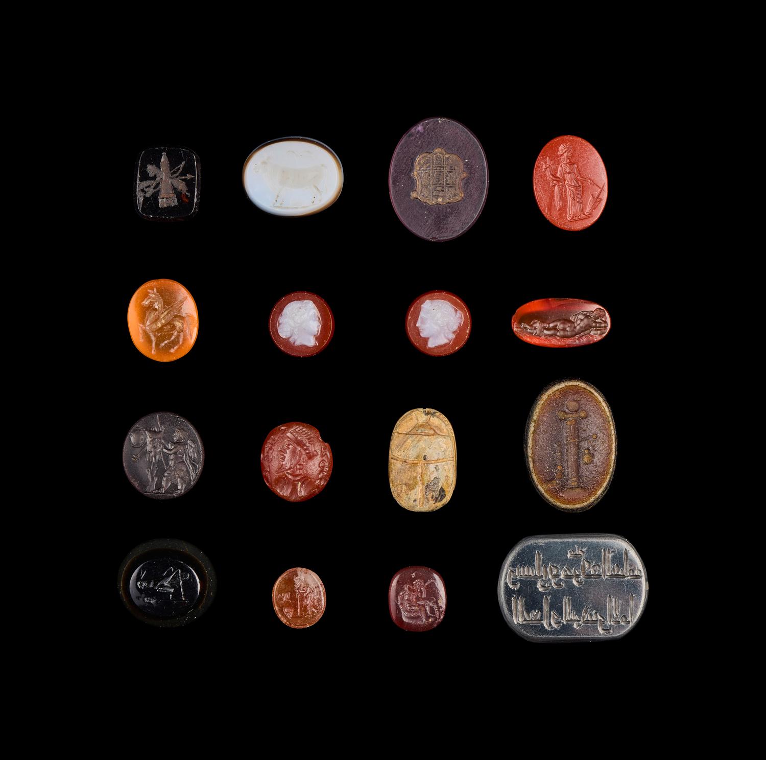 A Group of Sixteen Roman and Neoclassical Stone and Glass Intaglios