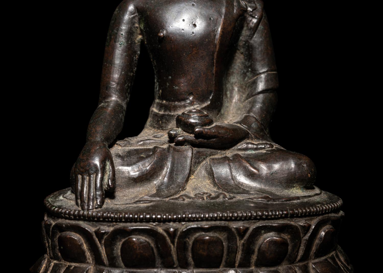 A Tibetan Bronze Figure of Seated Buddha Akshobhya