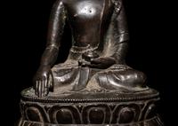 A Tibetan Bronze Figure of Seated Buddha Akshobhya