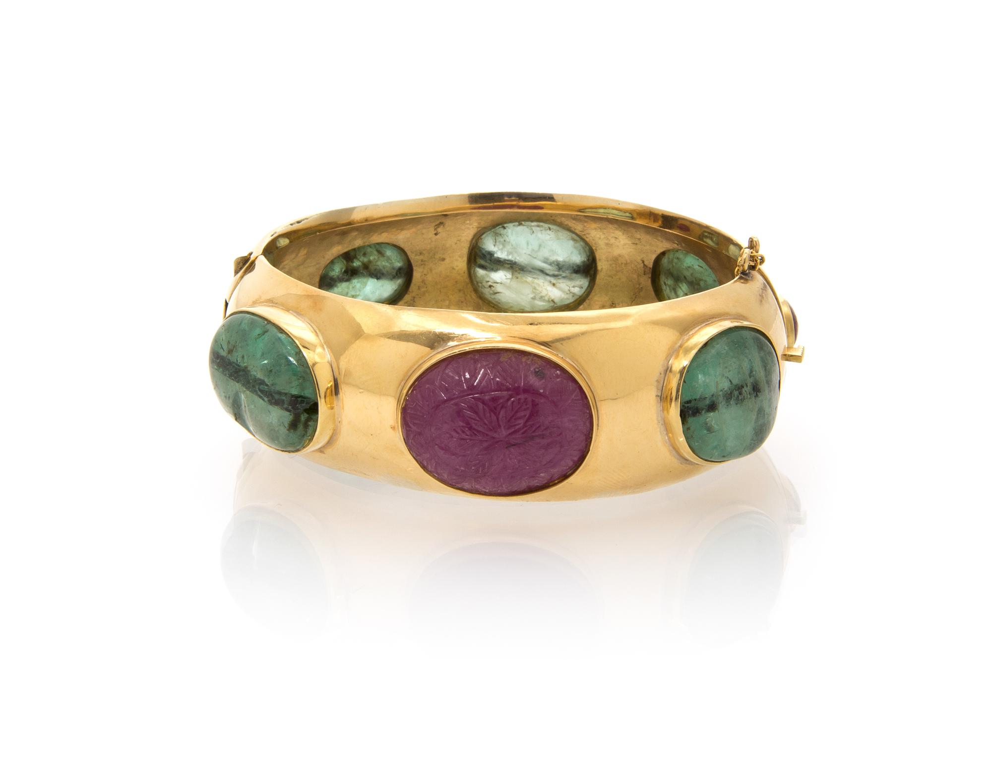 An 18 Karat Yellow Gold, Emerald and Ruby Bangle Bracelet, 47.20 dwts.