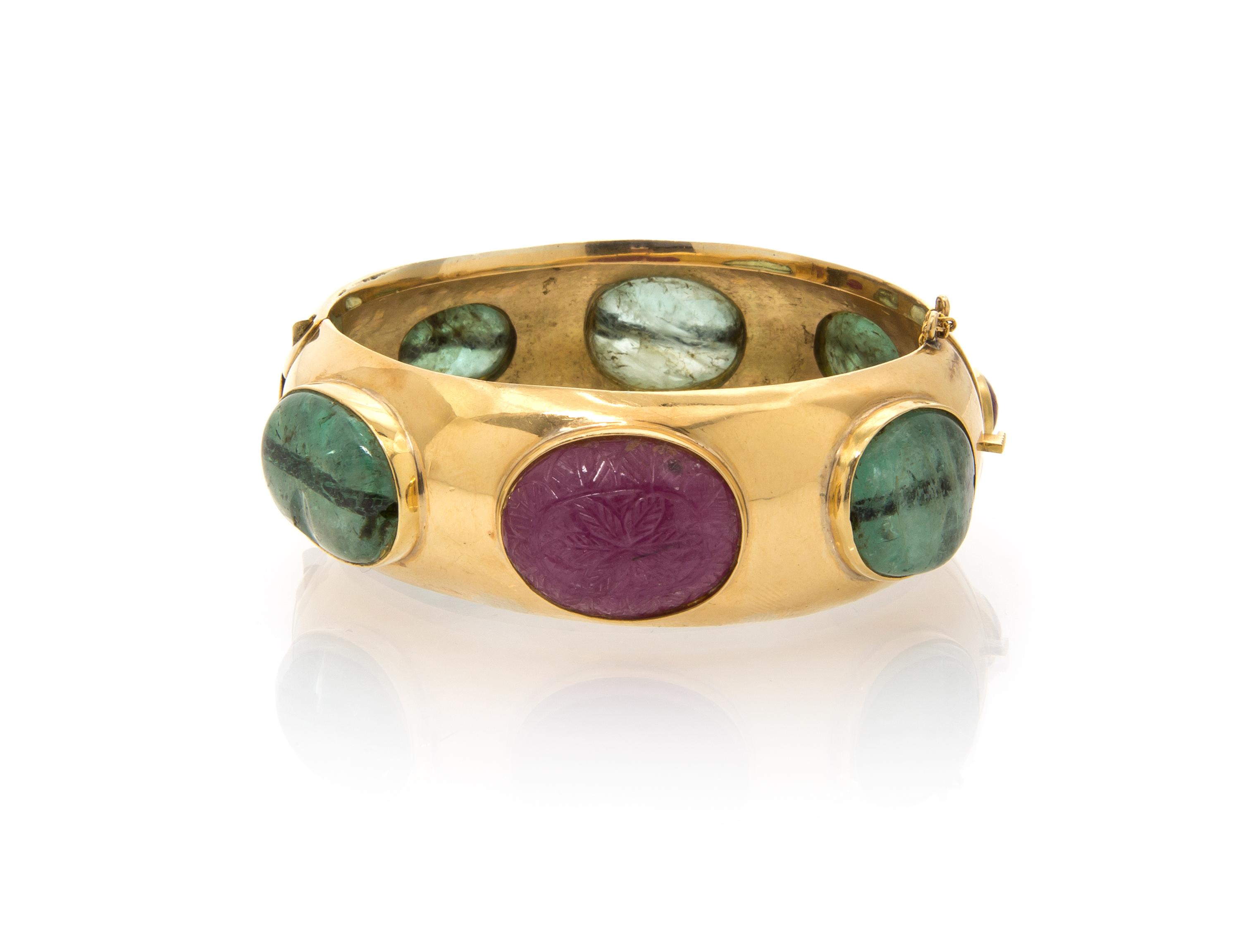 An 18 Karat Yellow Gold, Emerald and Ruby Bangle Bracelet, 47.20 dwts.