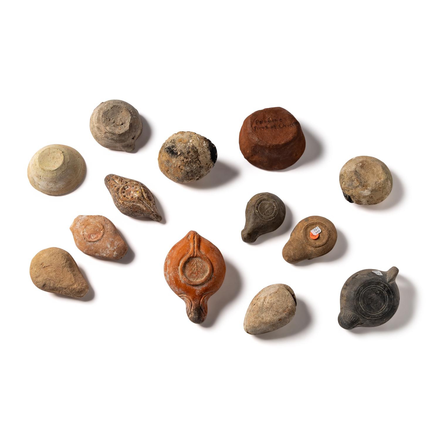 Thirteen Roman and Holy Land Terracotta Lamps