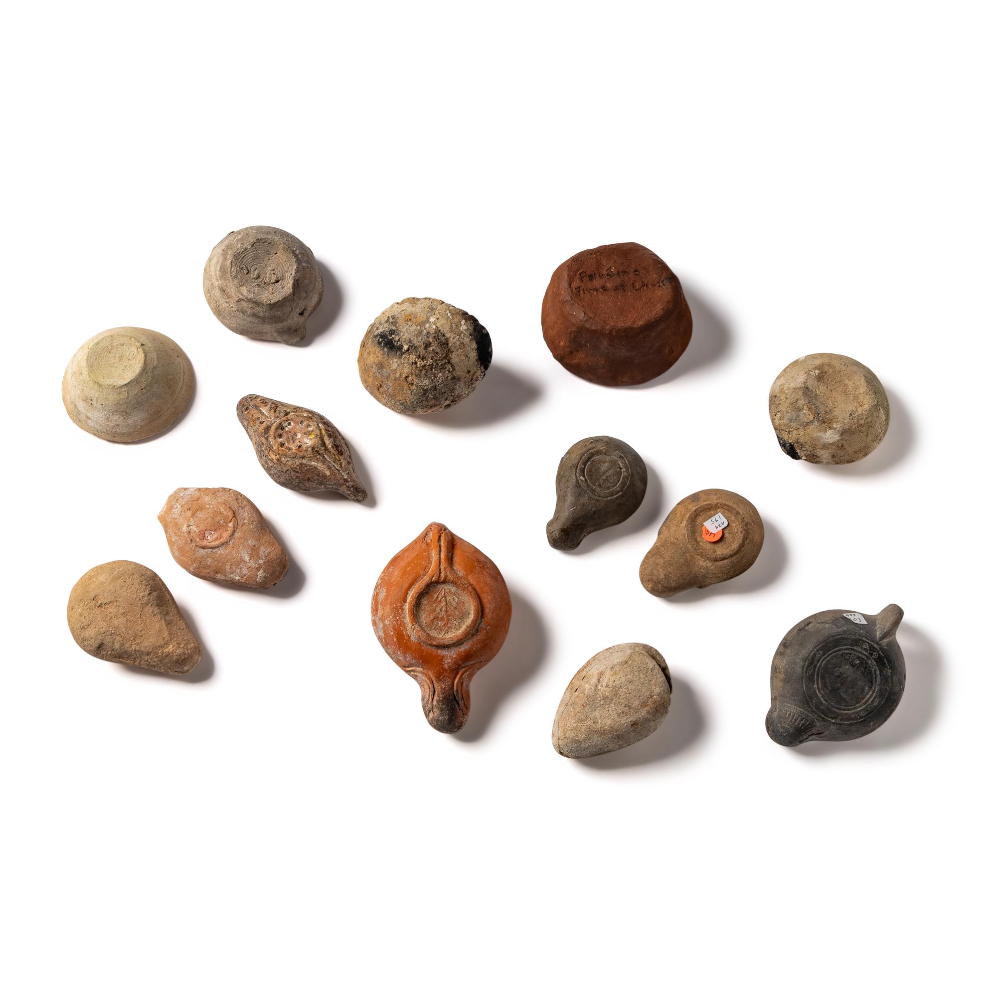 Thirteen Roman and Holy Land Terracotta Lamps