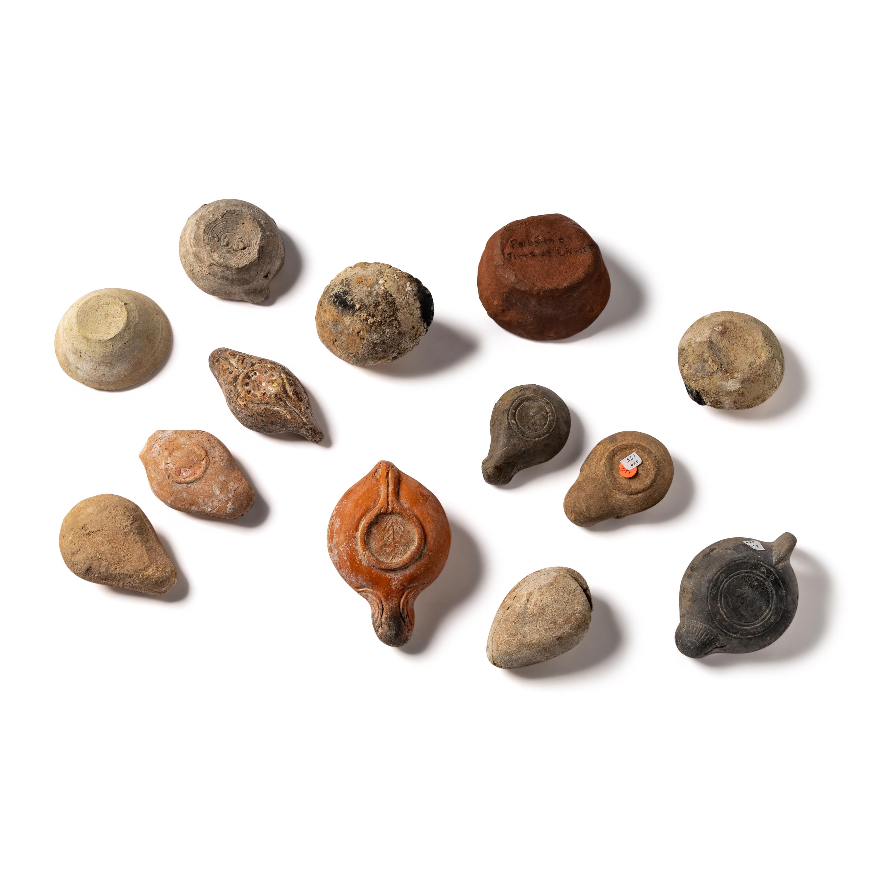 Thirteen Roman and Holy Land Terracotta Lamps
