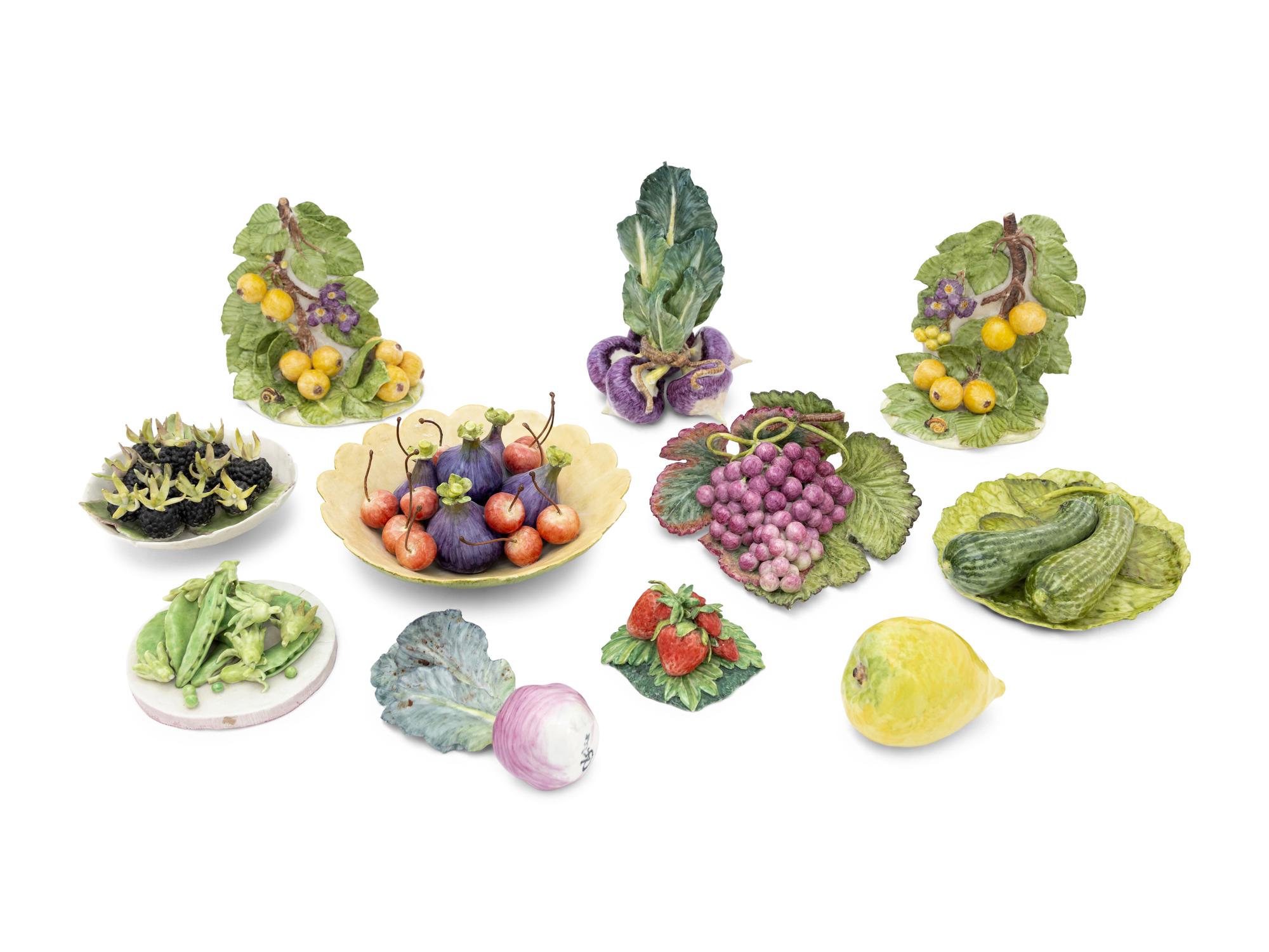 A Collection of Eleven Assorted Ceramic Fruit and Vegetable Articles in the Style of Eva Gordon