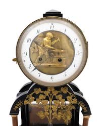 An Empire Gilt Metal Mounted Walnut Mantel Clock