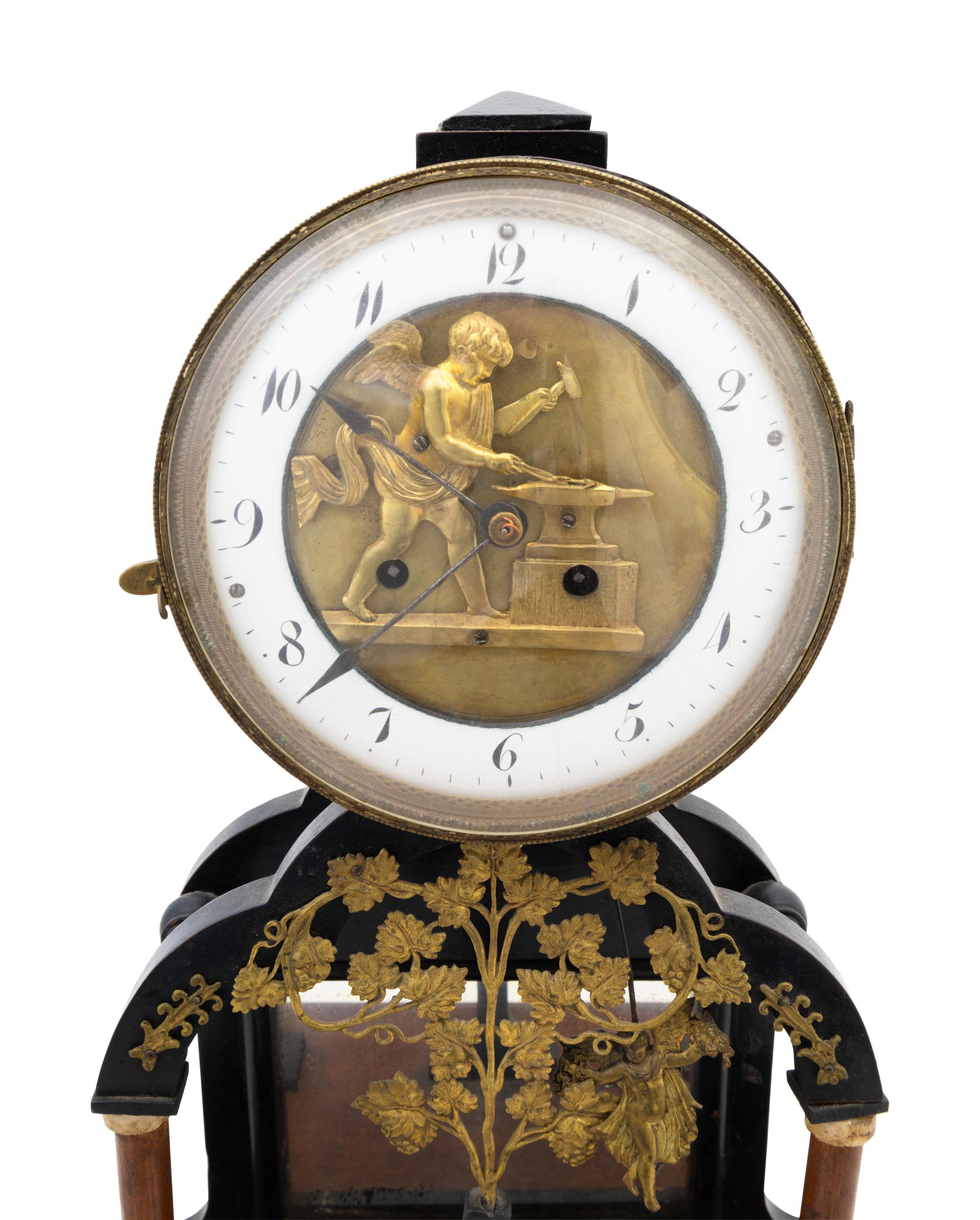 An Empire Gilt Metal Mounted Walnut Mantel Clock