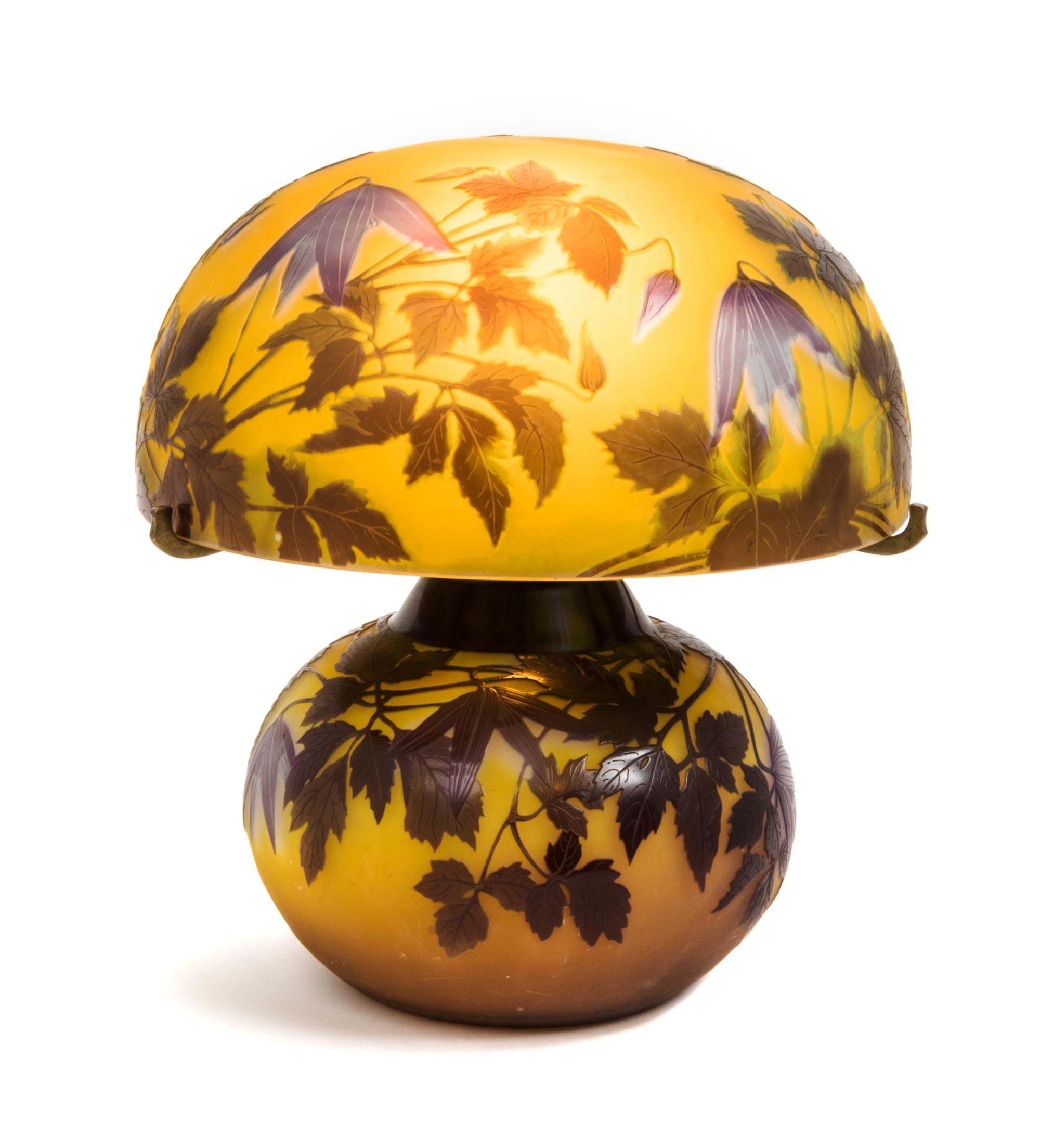 Emile Galle, (French, 1846-1904), an Alpina Clematis cameo glass lamp, the shade and base with conforming leafy decoration