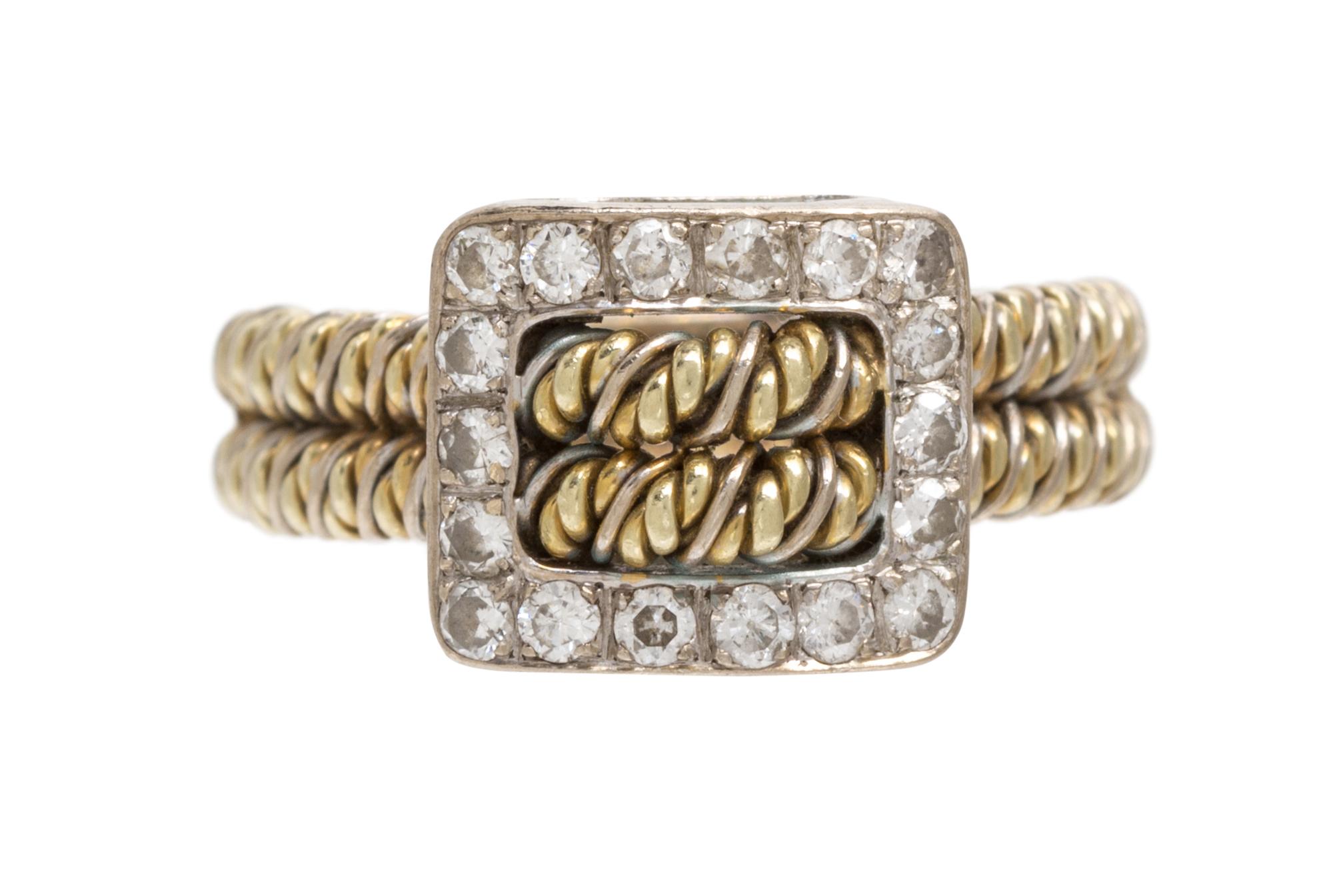A 14 Karat Two Tone Gold and Diamond Buckle Motif Ring, 5.50 dwts.