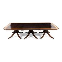 A Regency Style Mahogany and Satinwood Three-Pedestal Dining Table