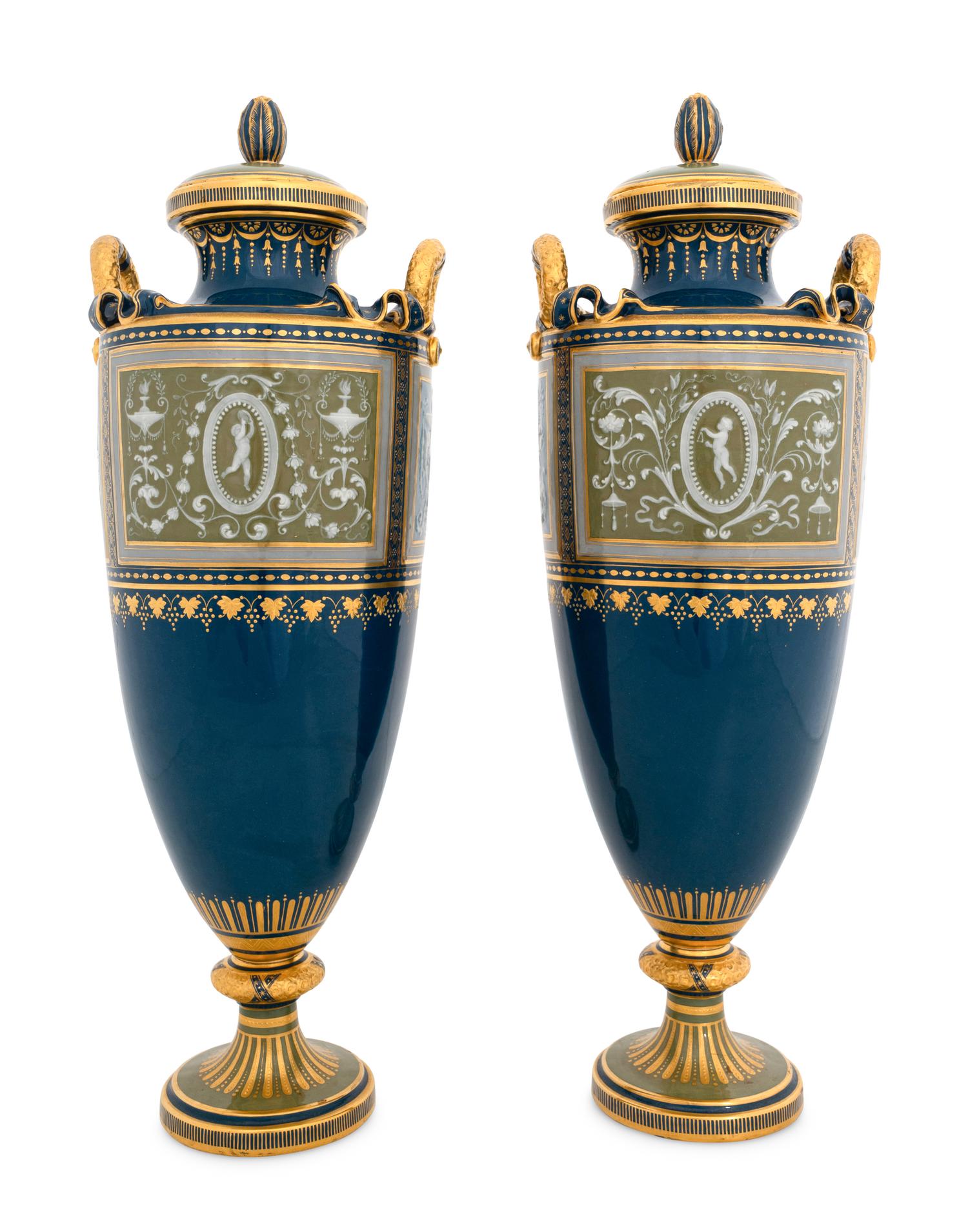 A Pair of Mintons Pâte-sur-Pâte Peacock Blue Covered Urns
