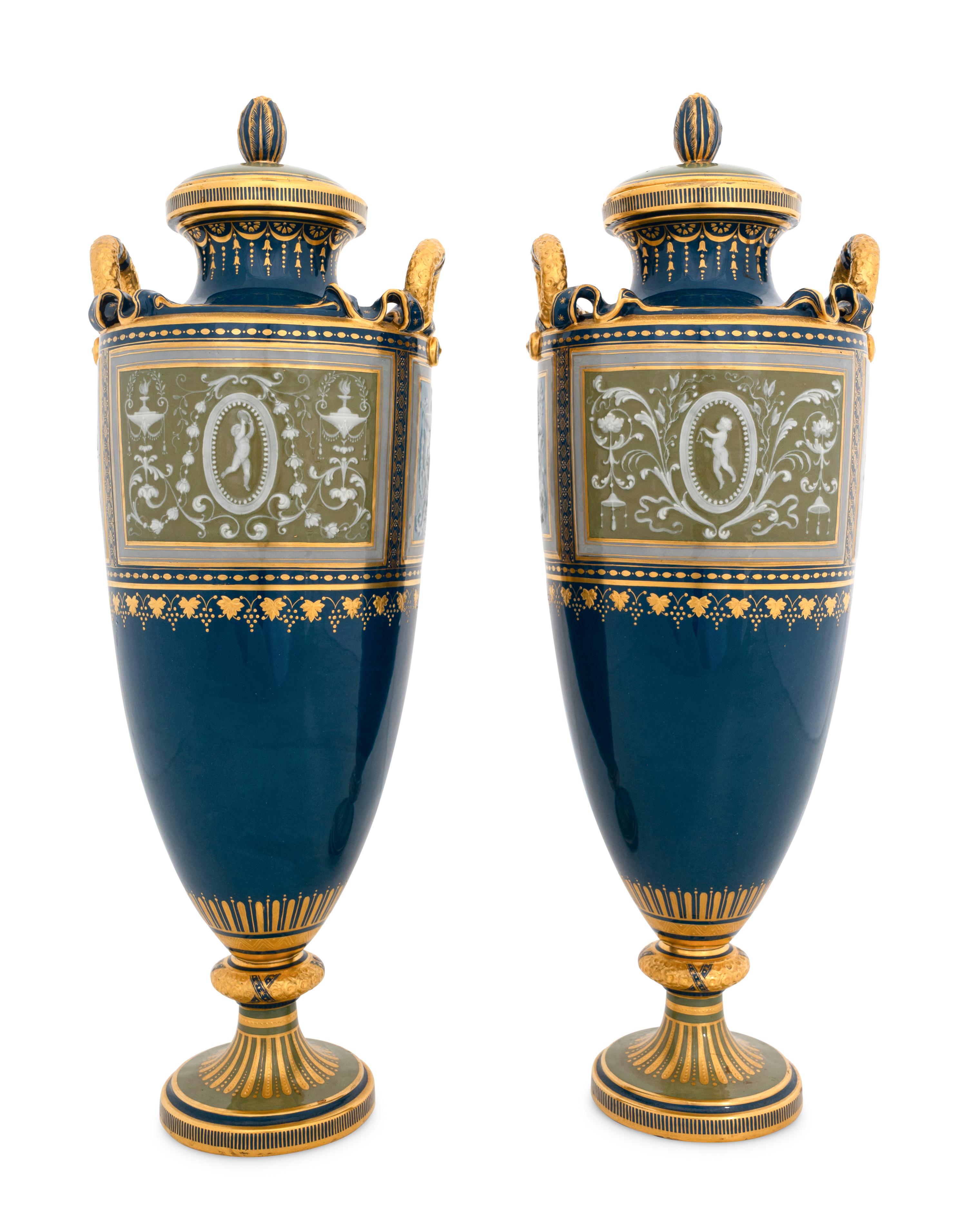 A Pair of Mintons Pâte-sur-Pâte Peacock Blue Covered Urns