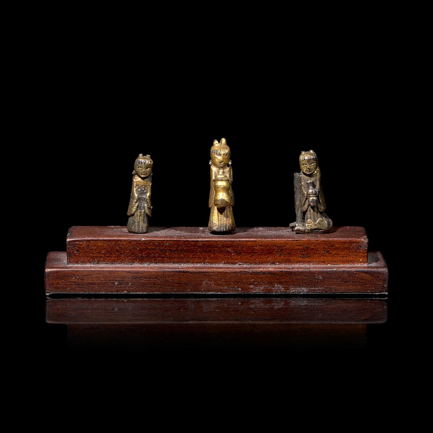 An Unusual Group of Three Chinese Gilt Bronze Miniature Deities, Ming Dynasty 明 銅鎏金袖珍小佛一組三件