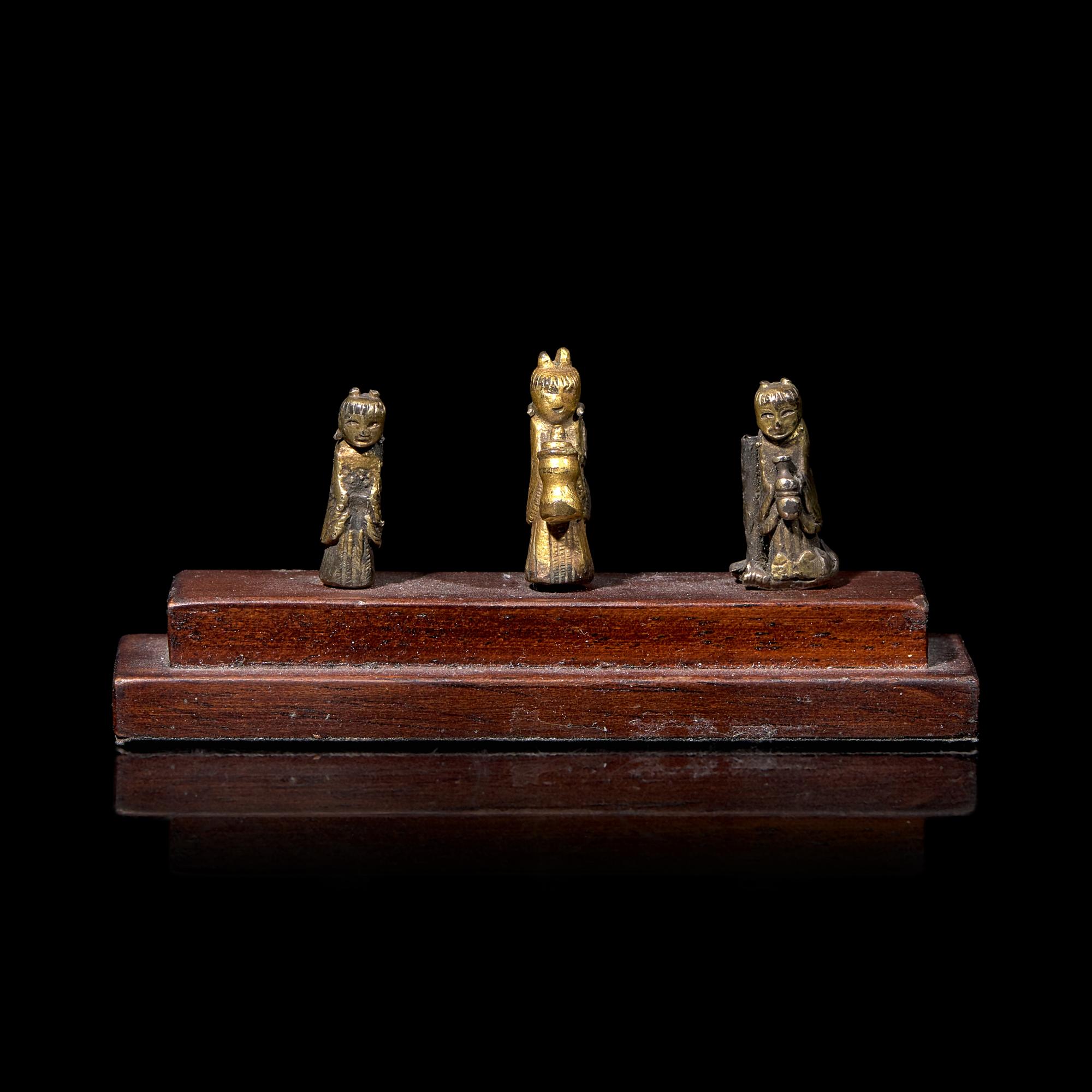 An Unusual Group of Three Chinese Gilt Bronze Miniature Deities, Ming Dynasty 明 銅鎏金袖珍小佛一組三件