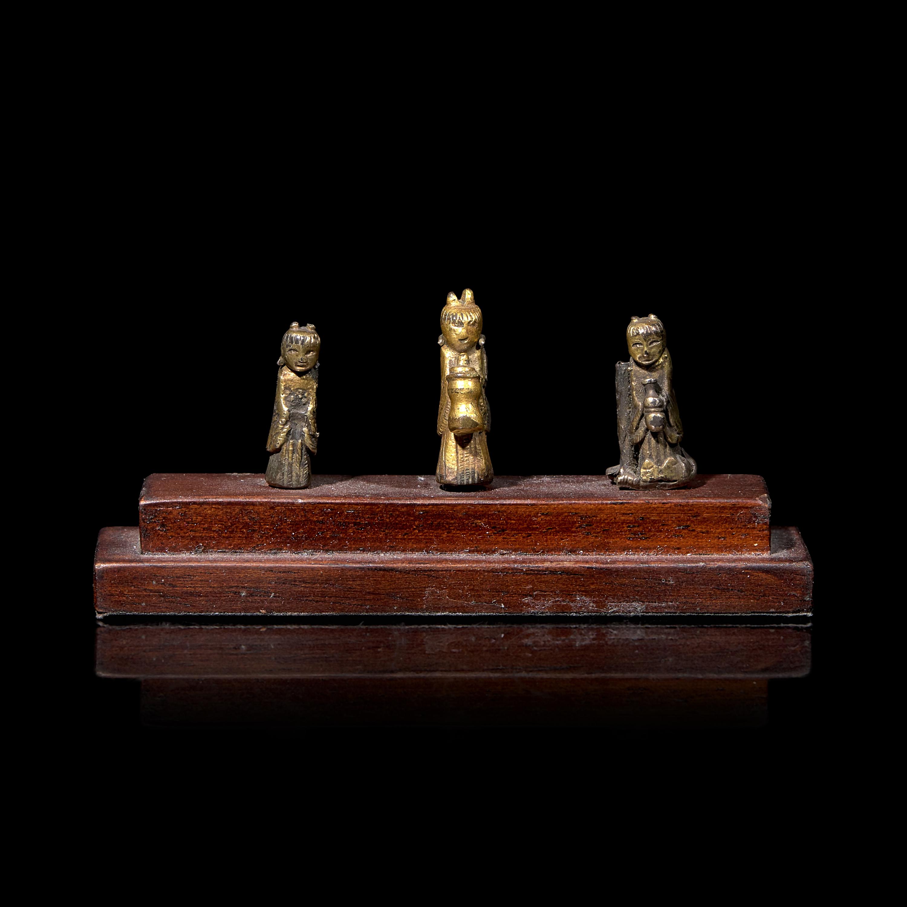 An Unusual Group of Three Chinese Gilt Bronze Miniature Deities, Ming Dynasty 明 銅鎏金袖珍小佛一組三件