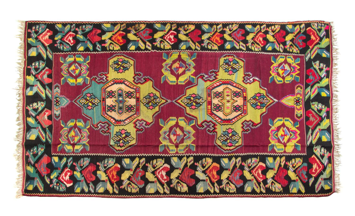 A Kilim Flat Weave Wool Rug 10 feet 2 inches x 7 feet 4 inches. — 20TH CENTURY