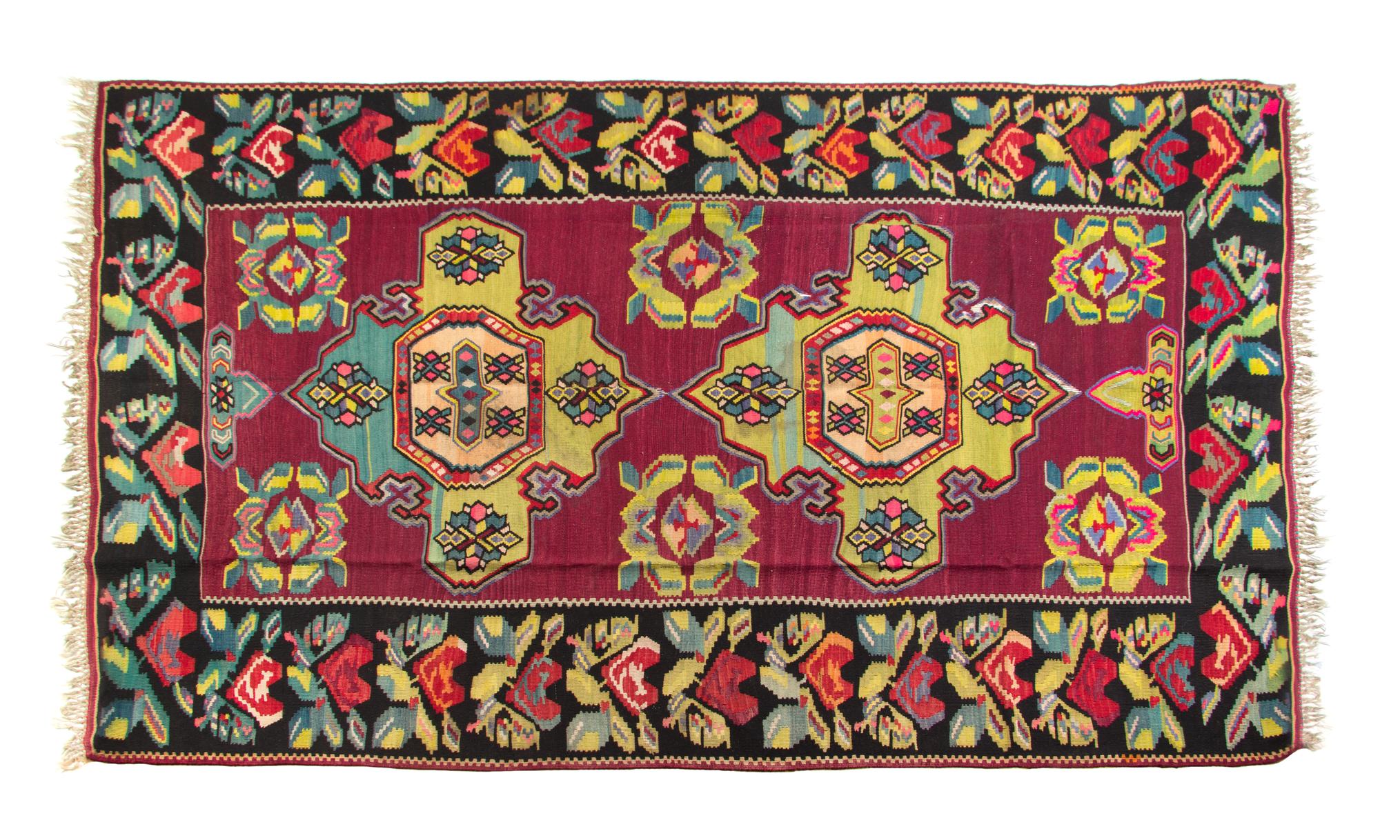 A Kilim Flat Weave Wool Rug 10 feet 2 inches x 7 feet 4 inches. — 20TH CENTURY