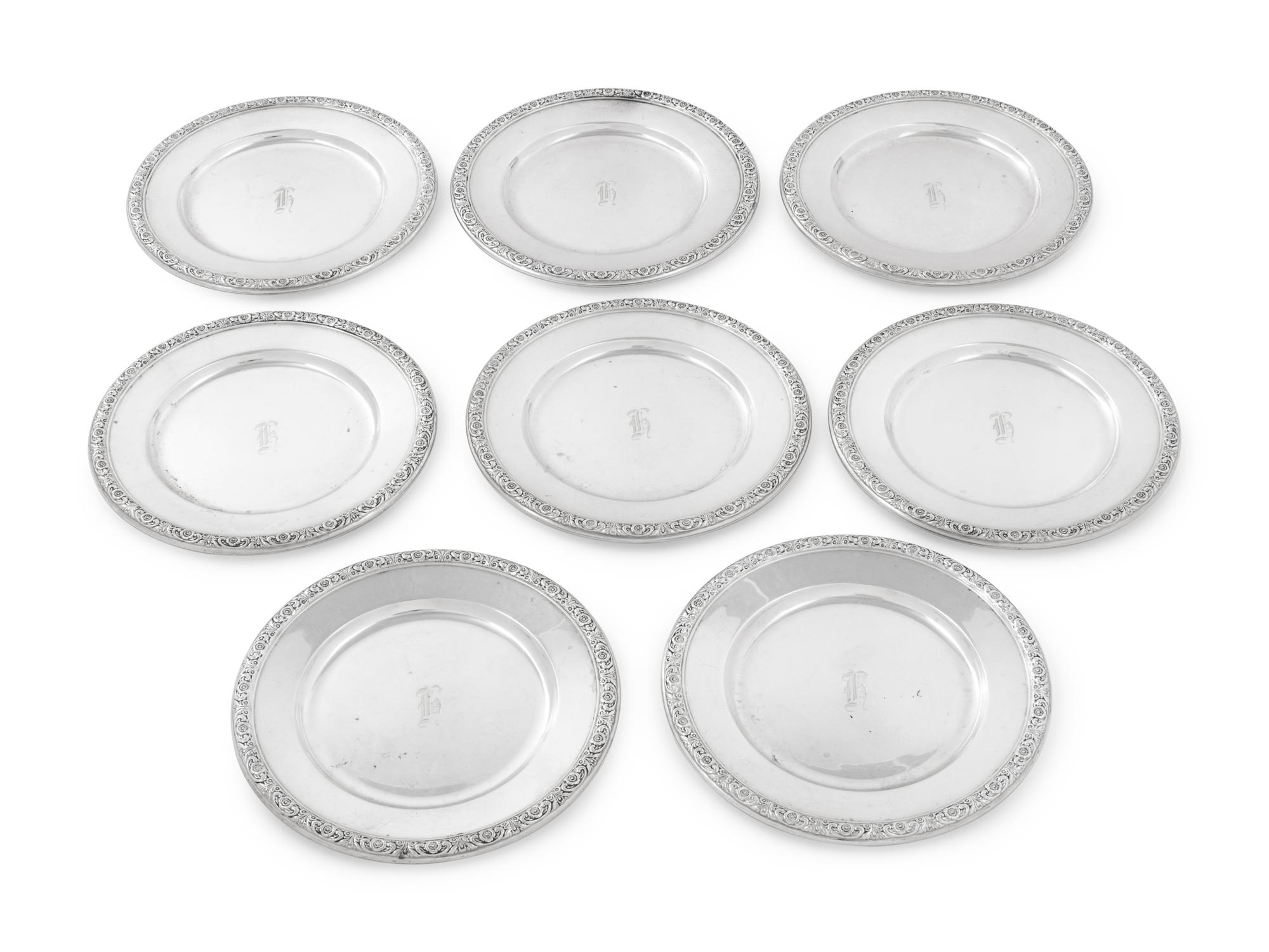A Set of Eight International Sterling Bread Plates