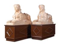 A Pair of Large Composite Marble Sphinxes