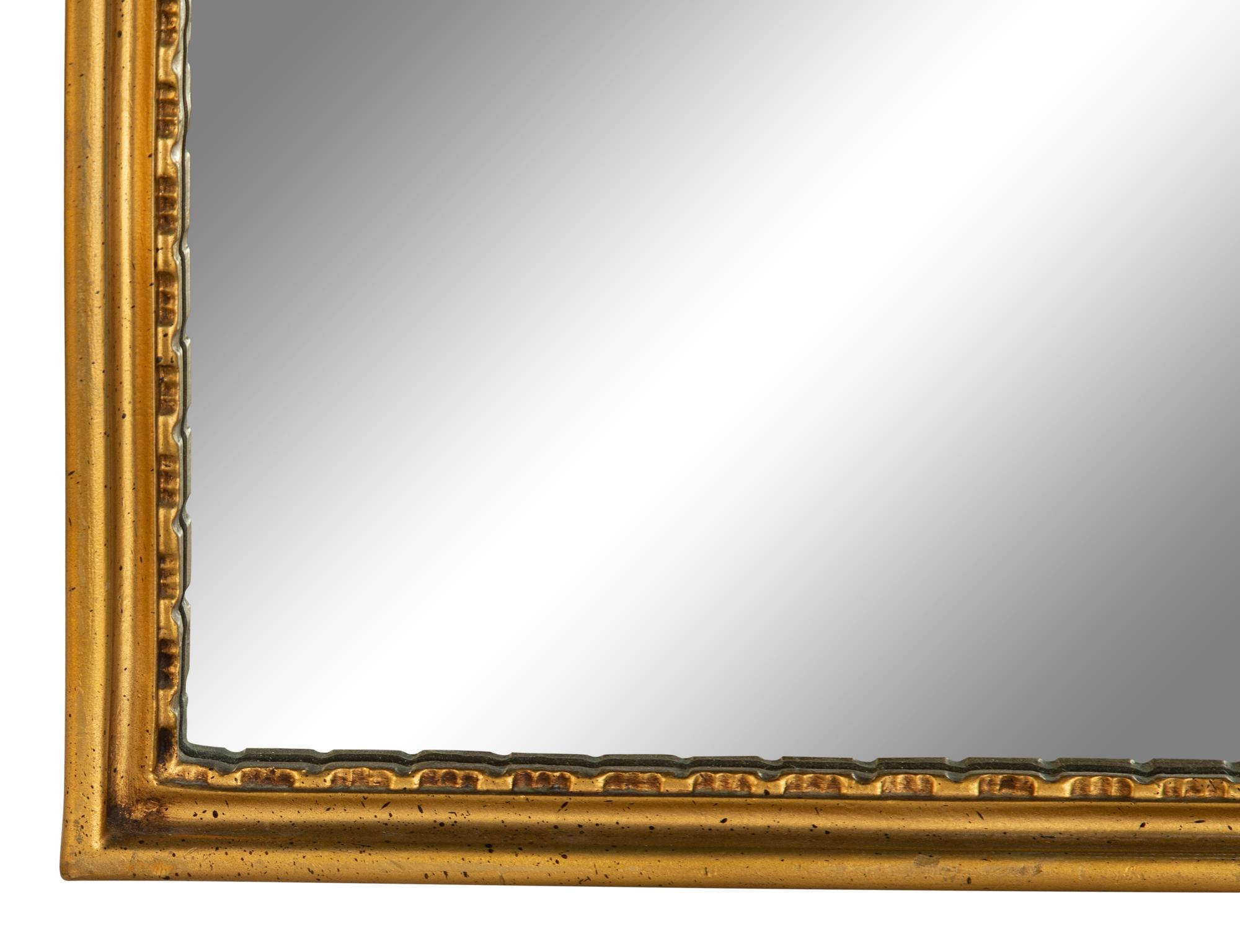 An Italian Baroque Style Giltwood Mirror