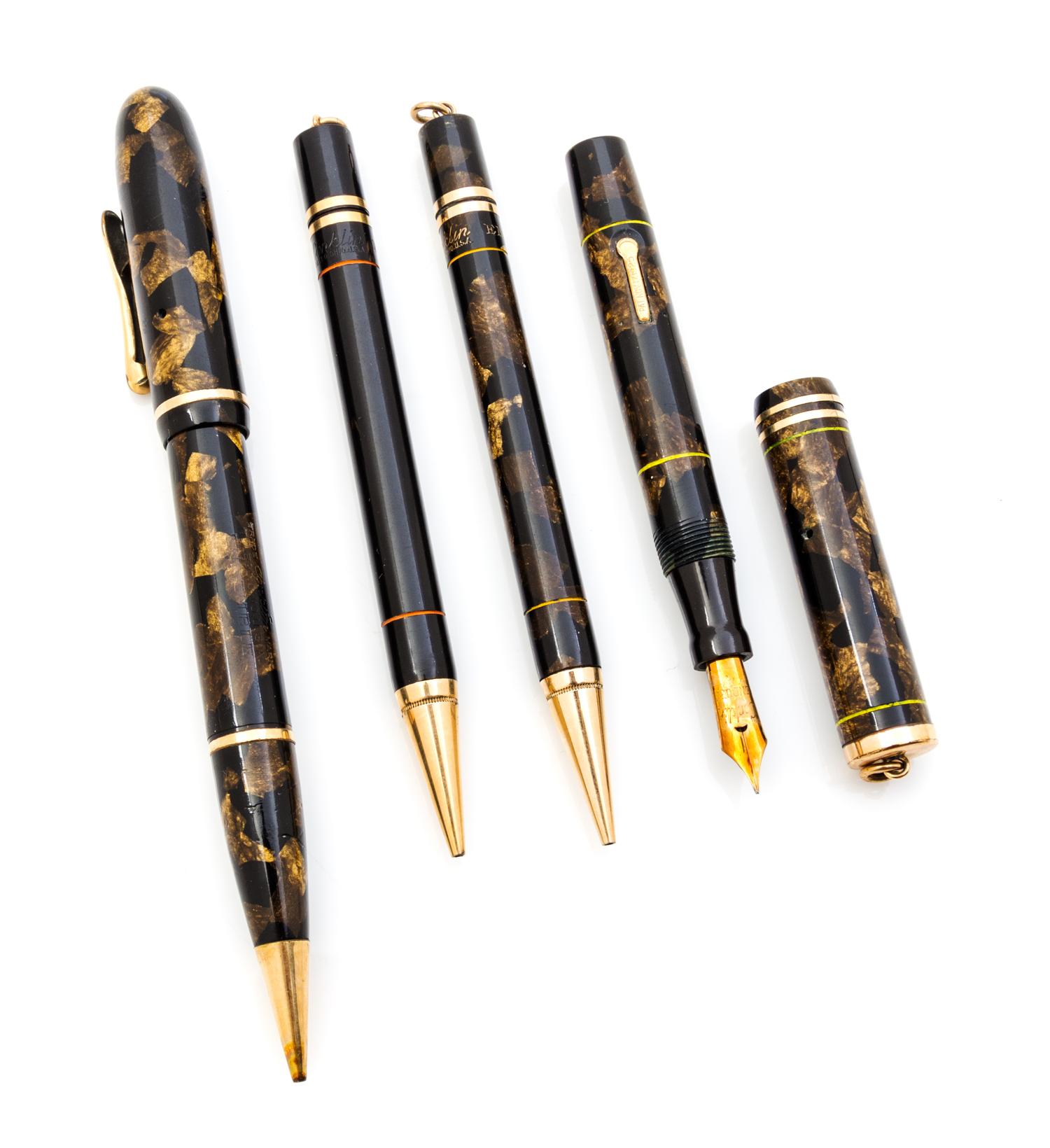 A Collection of Four Vintage Conklin Writing Instruments Length of longest 5 3/4 inches.