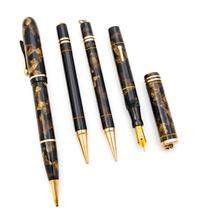 A Collection of Four Vintage Conklin Writing Instruments Length of longest 5 3/4 inches.