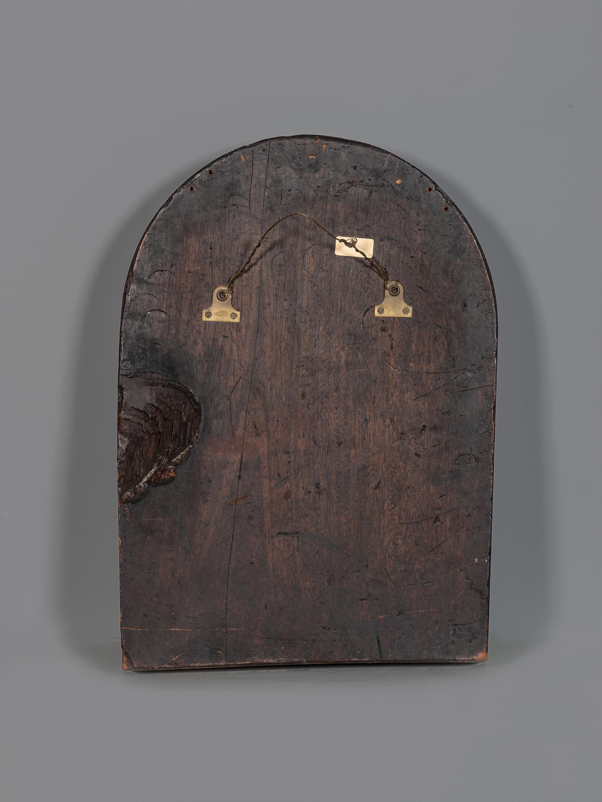 A Carved Walnut Ship Board Panel of a Sailor