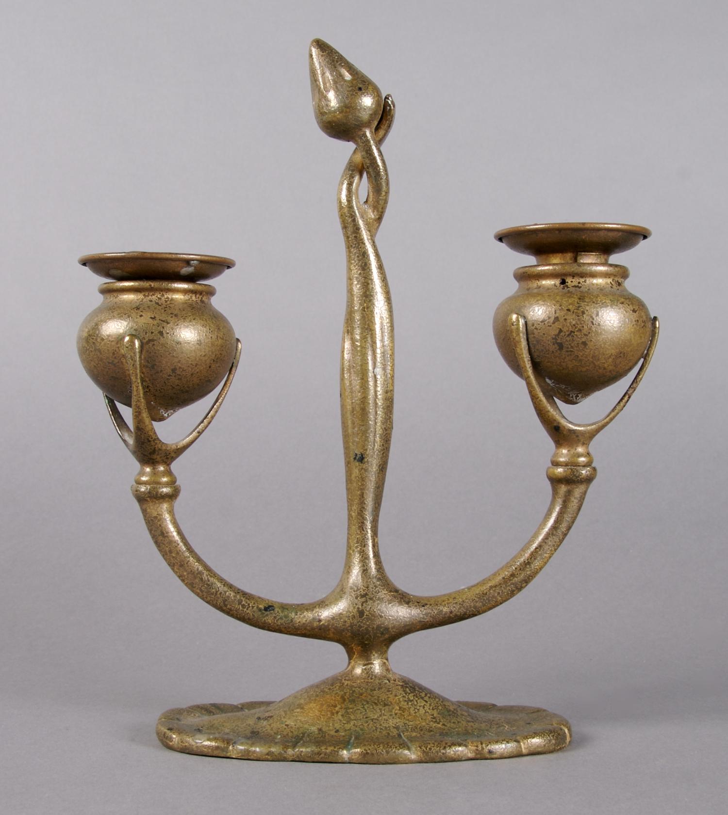 A Tiffany Studios Bronze Two-Light Candelabra, Height 9 inches.