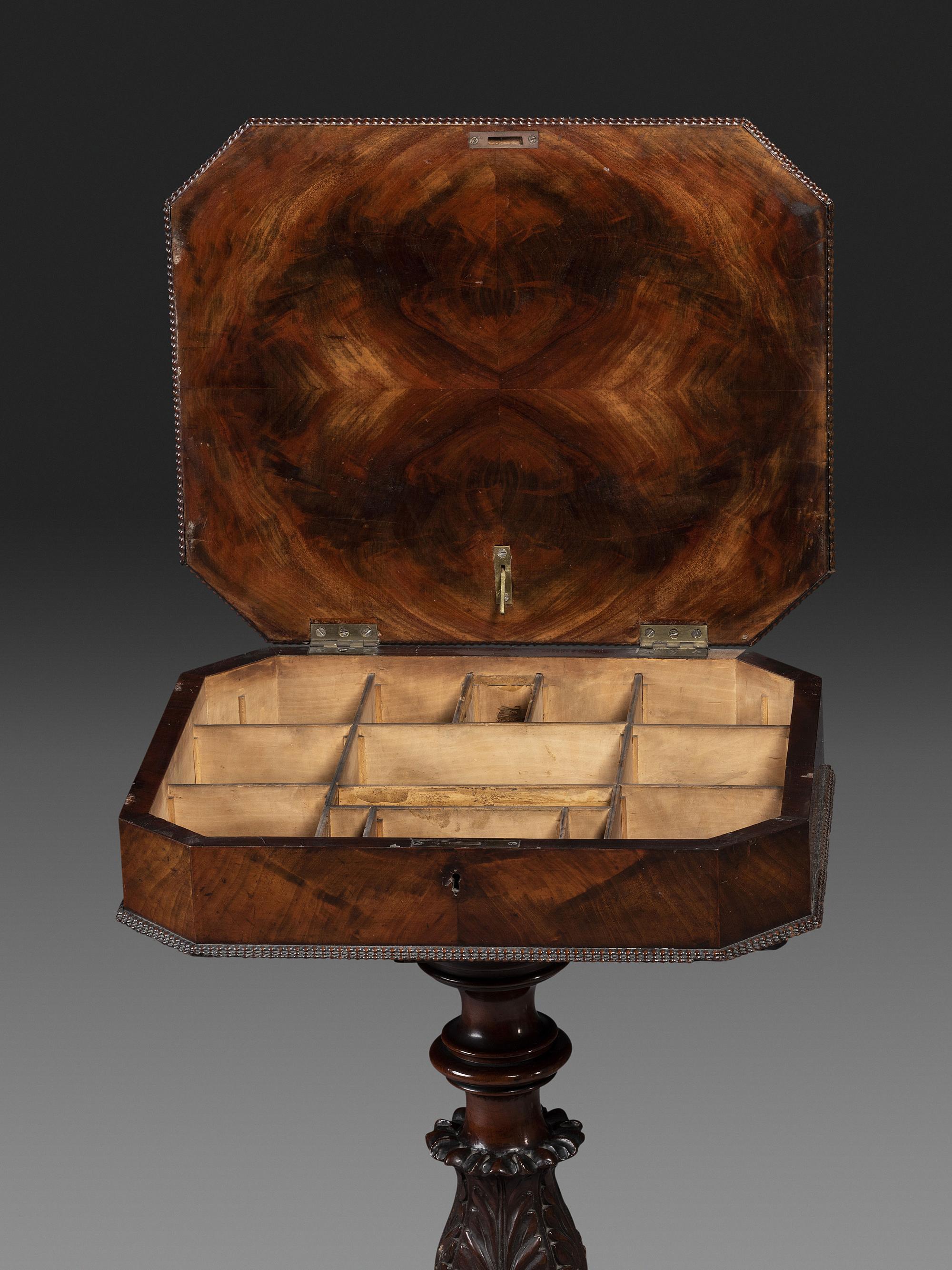 A Classical Carved and Figured Mahogany Work Table
