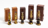 A Group of Five Cased and Lacquered Brass Drum Microscopes Height of tallest 7 3/4 inches. — LATE 19TH/EARLY 20TH CENTURY