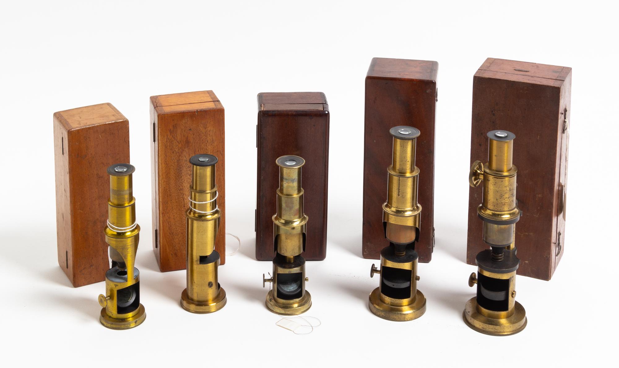 A Group of Five Cased and Lacquered Brass Drum Microscopes Height of tallest 7 3/4 inches. — LATE 19TH/EARLY 20TH CENTURY