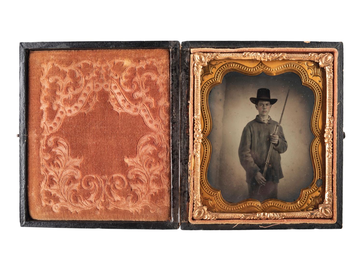[CIVIL WAR]. Sixth plate ambrotype of young Union soldier holding rifle with fixed bayonet.
